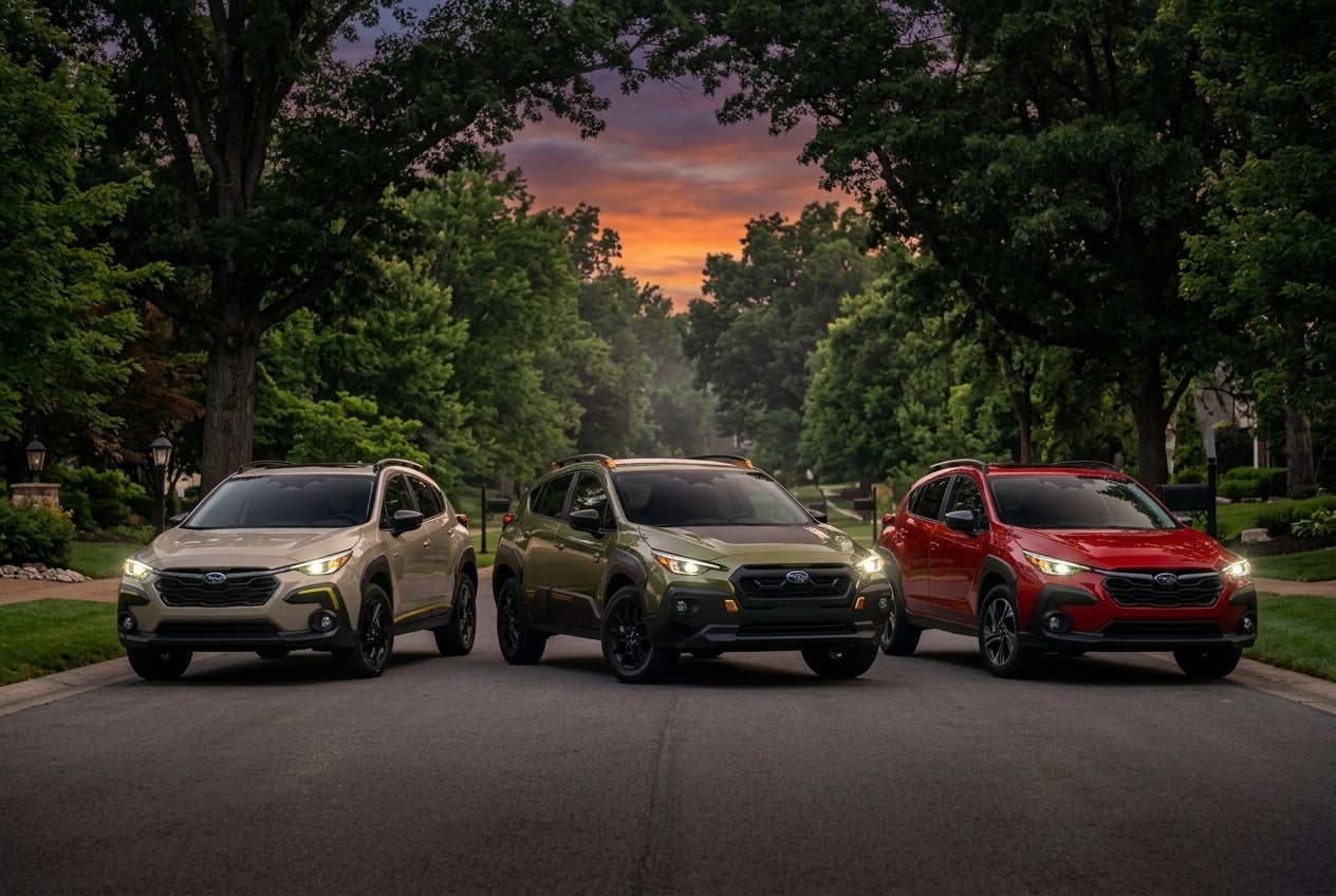 A display of various Subaru Crosstrek trims including the Wilderness and Limited editions.