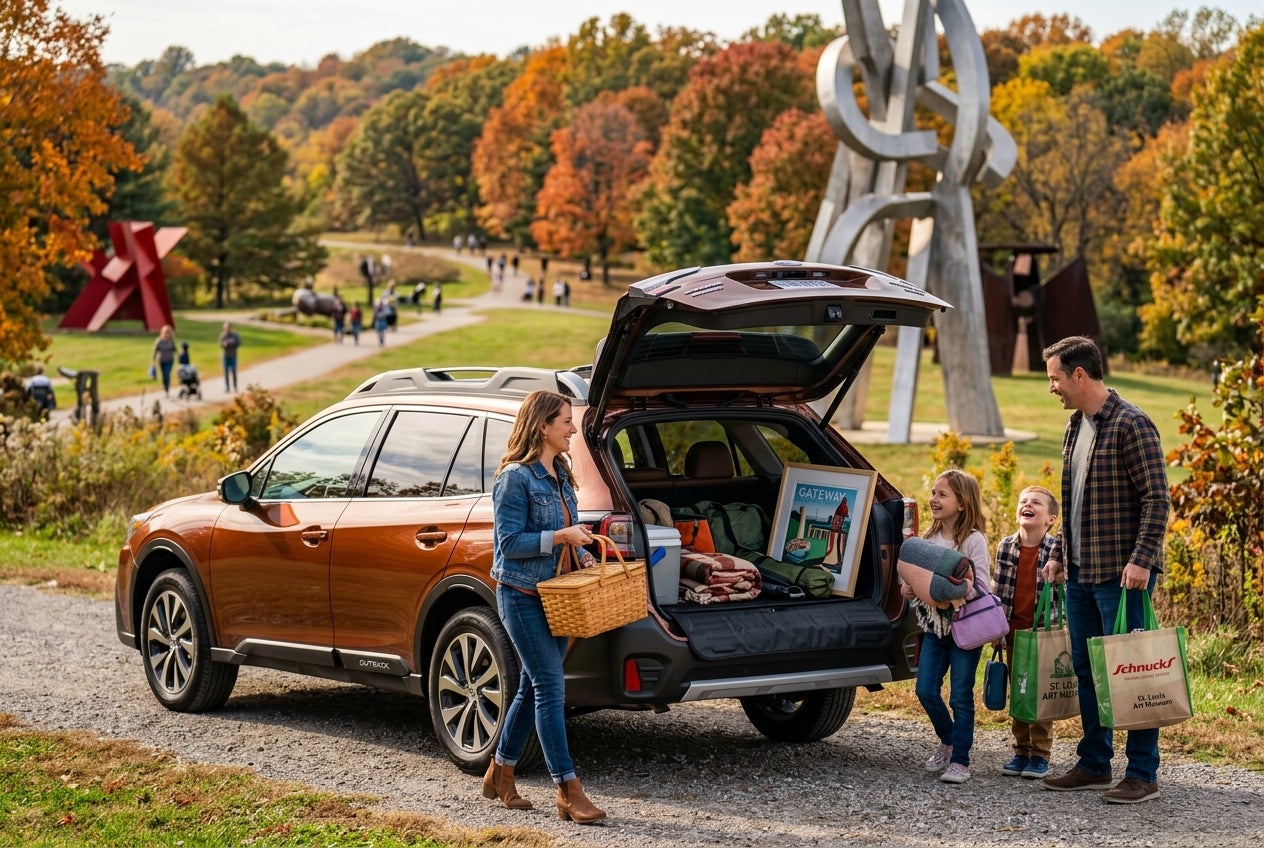 AI generated: Photorealistic cinematic lifestyle scene featuring a beautiful 2026 Subaru Outback parked near the iconic sculptures at Laumeier Sculpture Park during a sunny Missouri afternoon. A family unloads picnic supplies, shopping bags, and local art pieces from the spacious rear cargo area, showcasing the Outback’s versatility and generous storage space. The scene transitions into subtle storytelling moments: the Outback smoothly commuting along a scenic highway toward the distant downtown St. Louis skyline at golden hour, then later parked beside the wooded banks of the Meramec River during a peaceful weekend getaway. Rich autumn foliage and rolling Missouri landscapes surround the vehicle, emphasizing adventure, practicality, and community lifestyle. In the background, the modern exterior of Sunset Hills Subaru glows warmly under evening lights, creating a welcoming hometown dealership atmosphere. Ultra-detailed textures on metallic paint, leather interior surfaces, cargo gear, reflections on glass, natural sunlight, and scenic Missouri environments, cinematic depth of field, premium automotive commercial aesthetic, warm community-focused mood, 8K ultra realism.