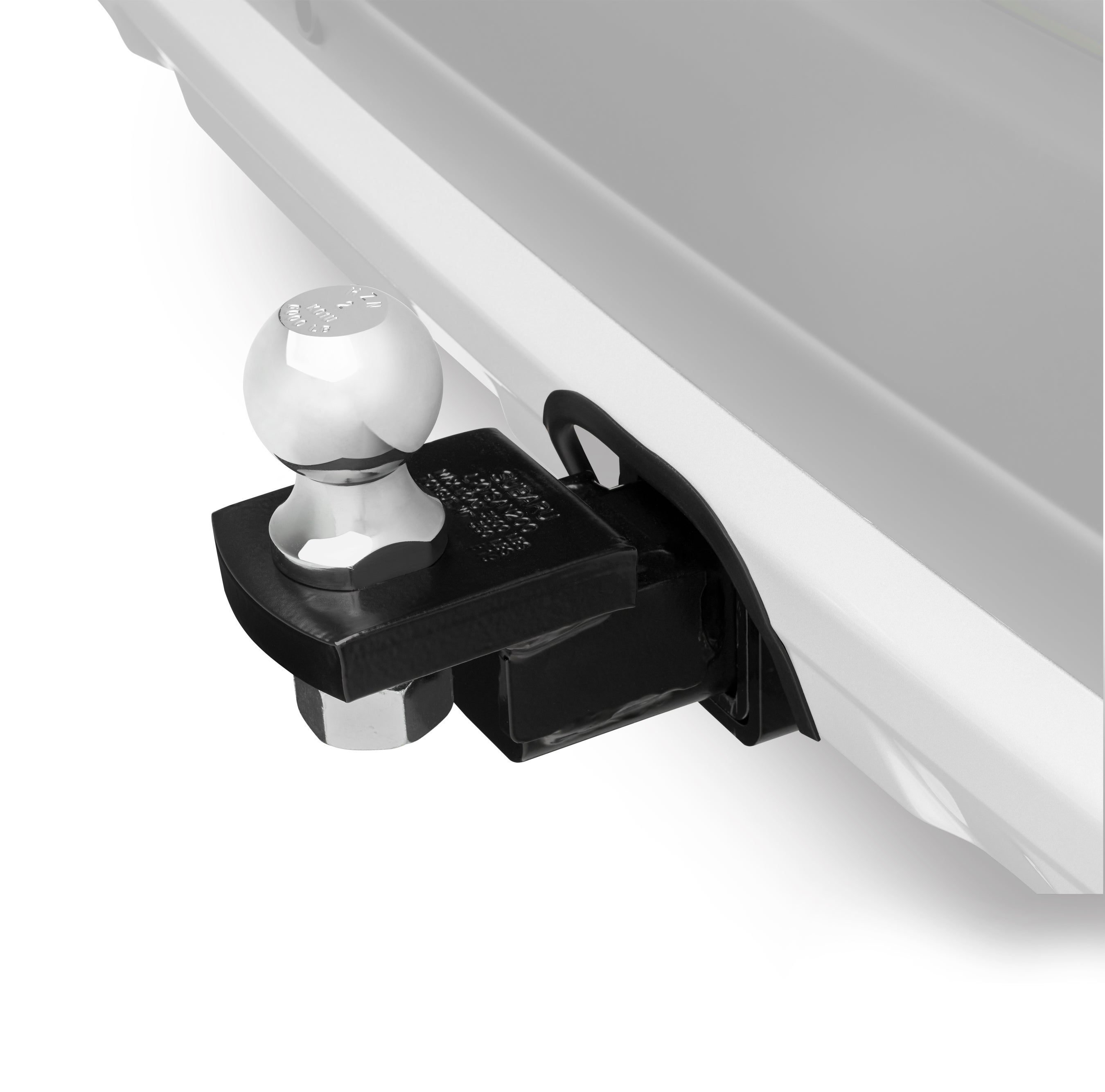 Chrome trailer hitch ball mounted on a black receiver hitch attached to a silver vehicle.