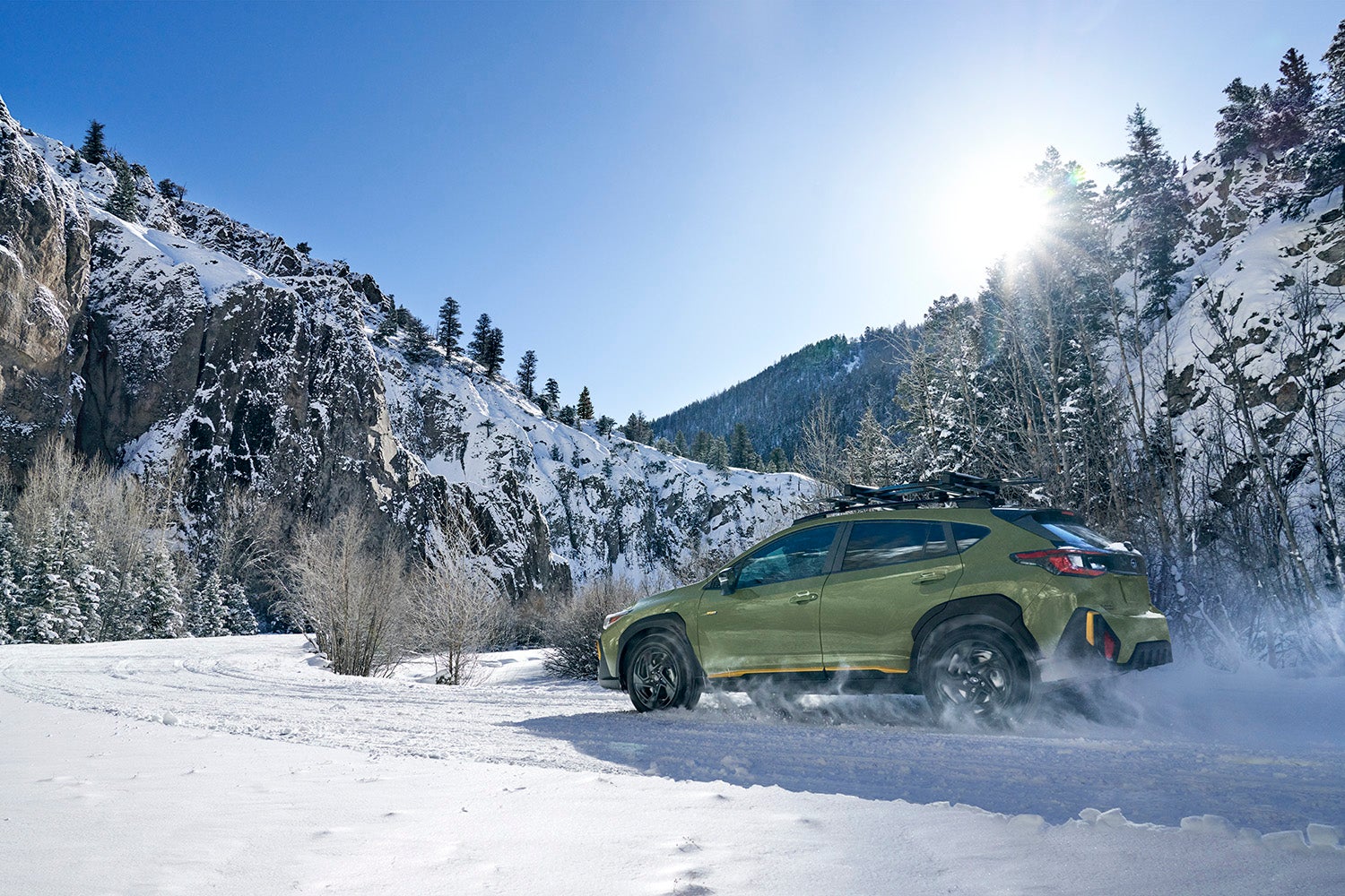 Close up of the Subaru X-MODE interface and the Crosstrek tackling a rugged path.