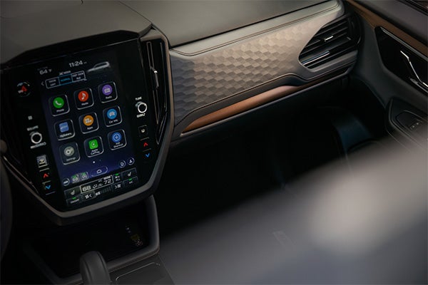 A smartphone connecting wirelessly to the Subaru STARLINK system showing Apple CarPlay in action.