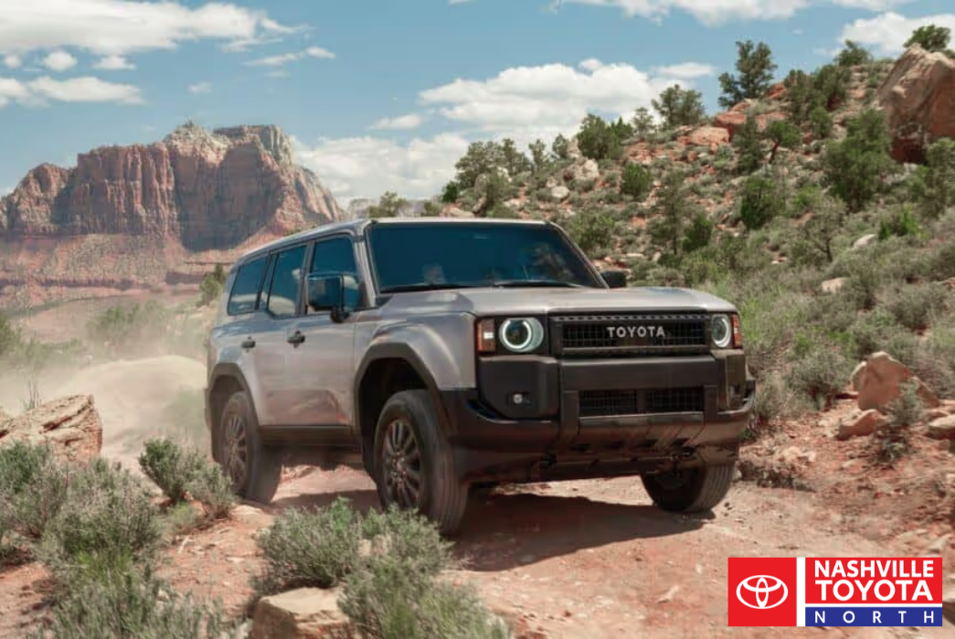 The 2025 toyota land cruiser is driving through the desert