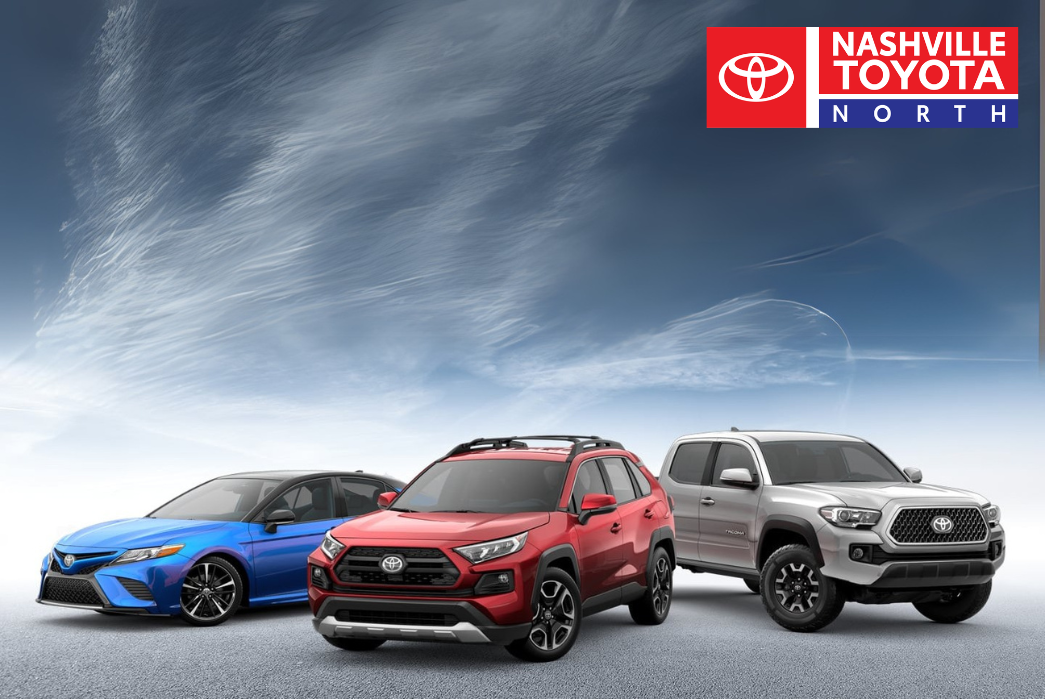 three toyota vehicles in front of a blue sky with clouds in the background