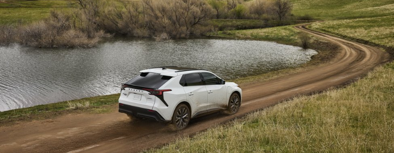 Action shot of 2026 Solterra driving down dirt road. Usage permitted in all media types.
