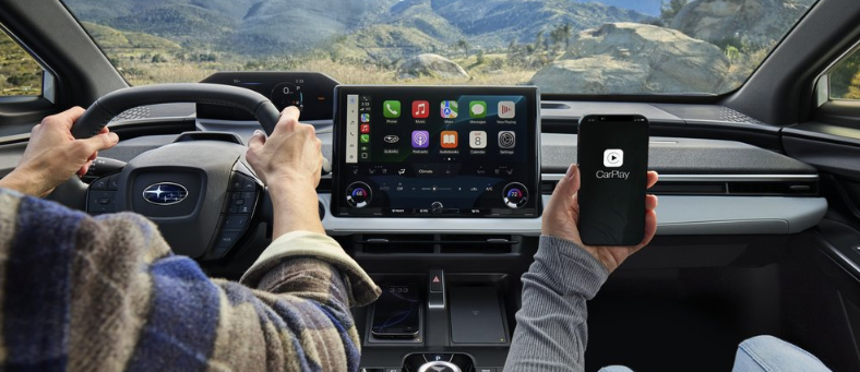 Detail Interior with mutlimedia screen. Talent driving in mountains. Usage permitted in all media types.