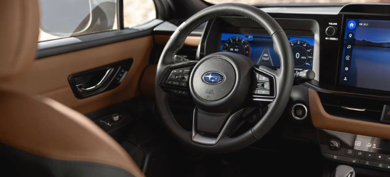 Interior feature image of the steering wheel in the 2026 Outback Touring with Java Brown Nappa Leather upholstery.
