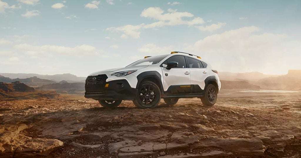2026 Subaru Crosstrek parked on rocky terrain in a desert landscape