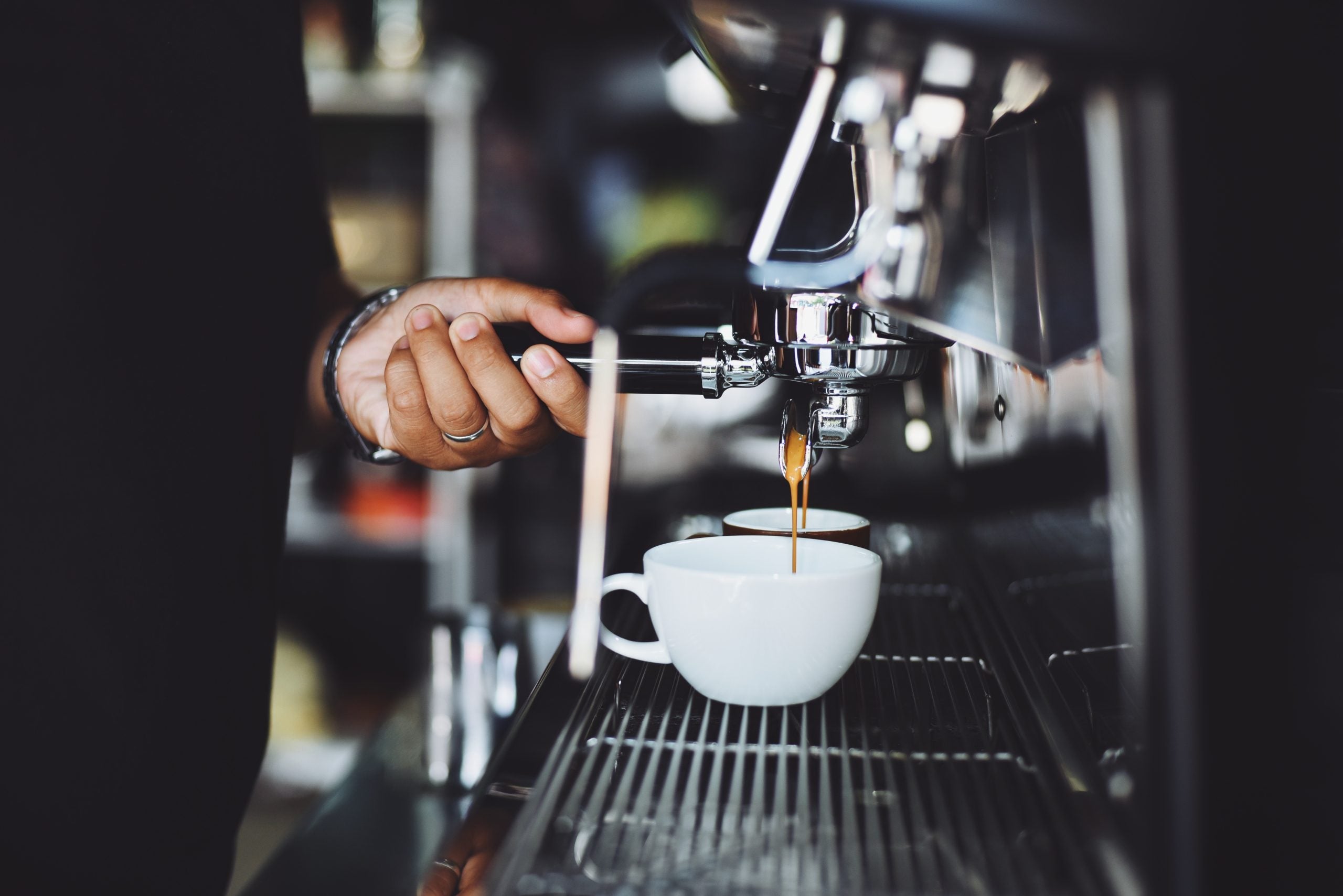 A person making a latte.