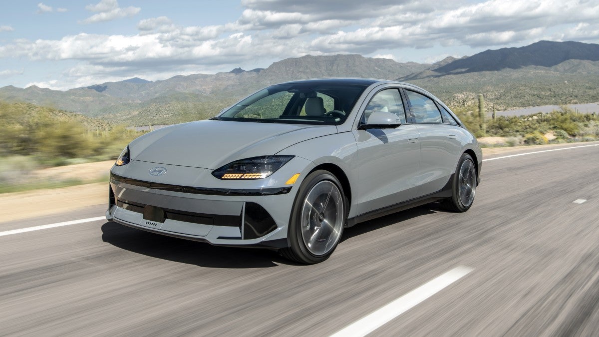 Front side view of a 2025 IONIQ 6 Limited driving on a road