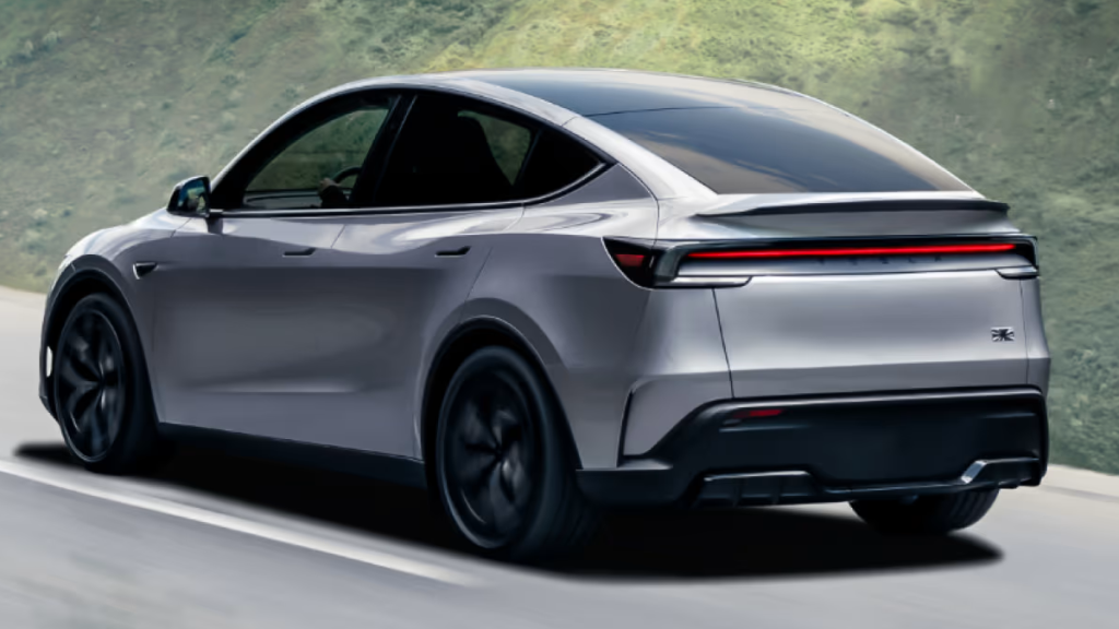 Rear view of a 2026 Tesla Model Y driving on a road