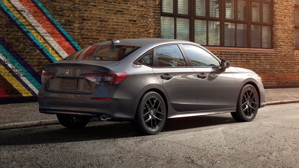 2026 Honda Sedan Sport Hybrid rear side view.