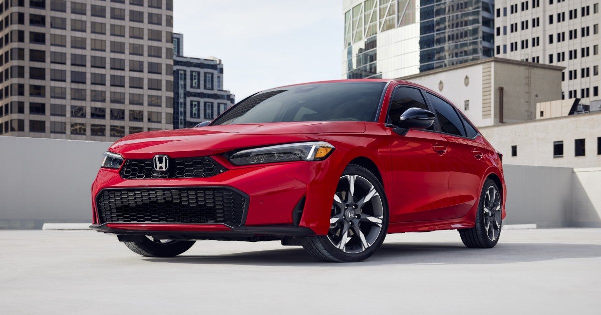 2025 Honda Civic Sedan Sport Touring Hybrid parked outside.