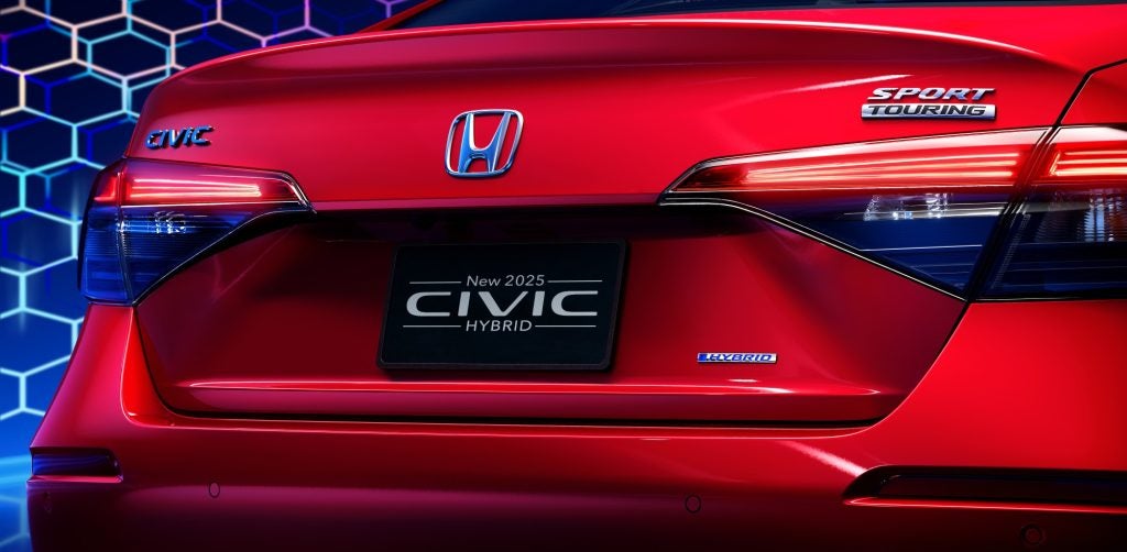 Rear close-up view of a red 2025 Honda Civic Sedan Hybrid trunk.
