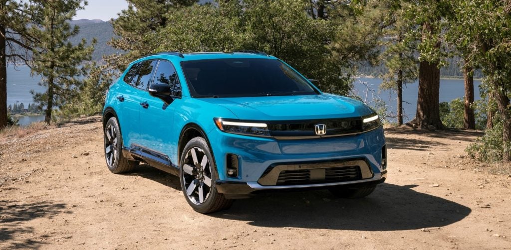 2024 Honda Prologue Elite parked off road in front of a body of water