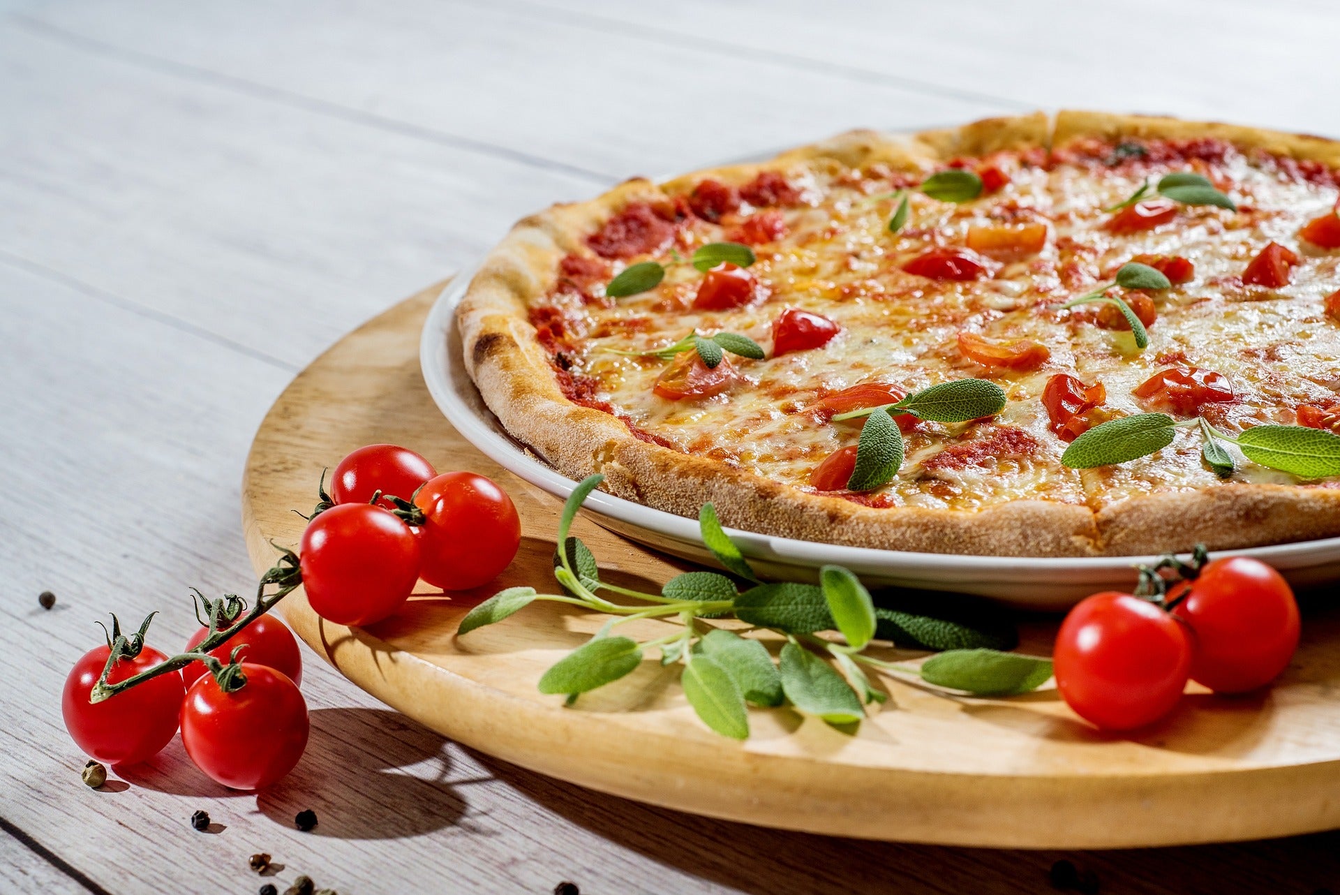 A pizza being served on a table