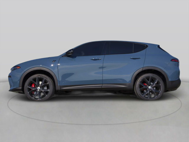 Driver's side view of a blue 2025 Dodge Hornet