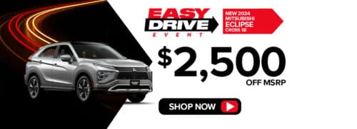 Silver Mitsubishi Eclipse Cross SE on a dark road with red and yellow streaks. Text: "Easy Drive Event," "$2,500 Off MSRP." Red "Shop Now" button.