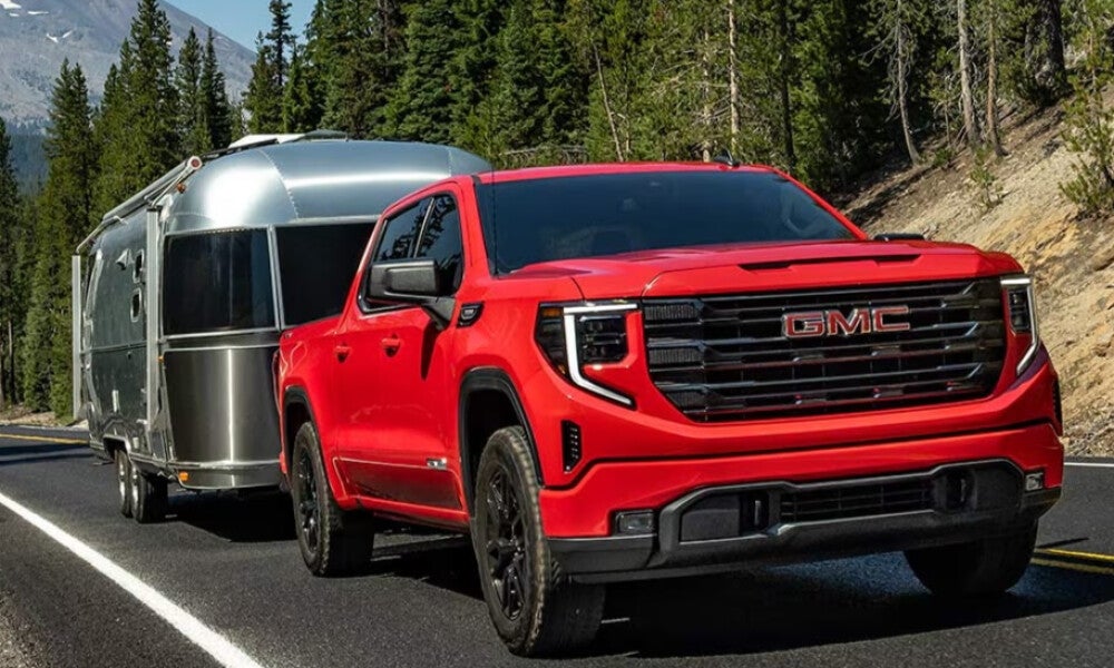 Red 2026 GMC Sierra 1500 towing 