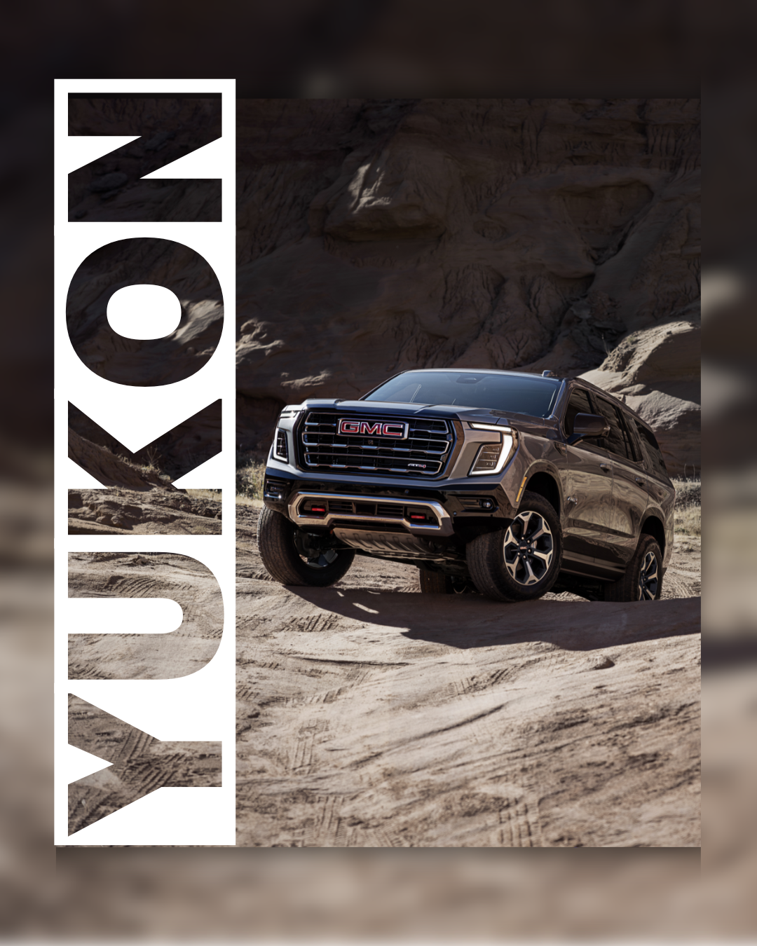 Dark colored Yukon driving on rocks