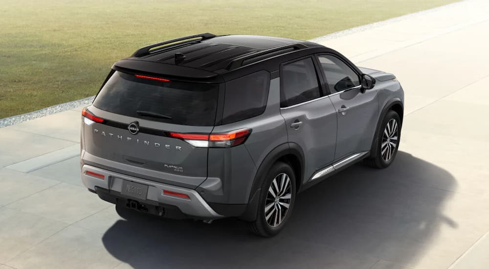 A gray 2025 Nissan Pathfinder parked in a driveway