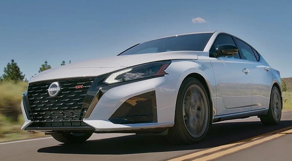 A white 2025 Nissan Altima SR is shown from the front at an angle.