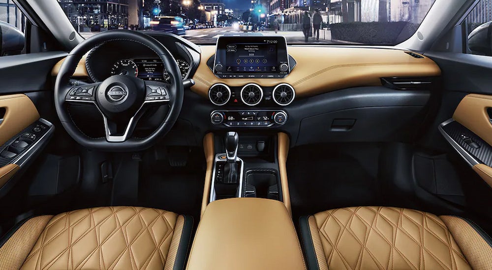 Tan leather upholstery and the dashboard in a 2024 Nissan Sentra SV at a Nissan dealer near Oak Ridge.