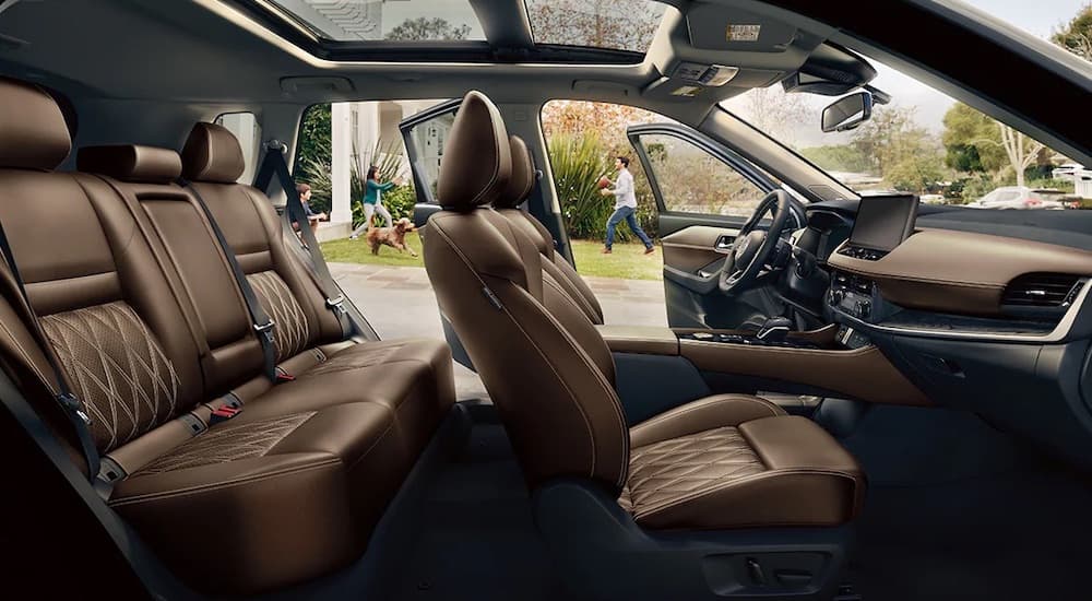 Front and back seats inside a 2025 Nissan Rogue SV.