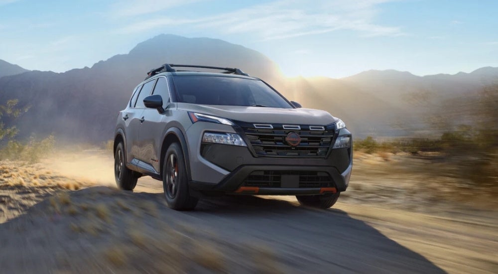 A grey 2026 Nissan Rogue for sale near Oak Ridge from the front at an angle.