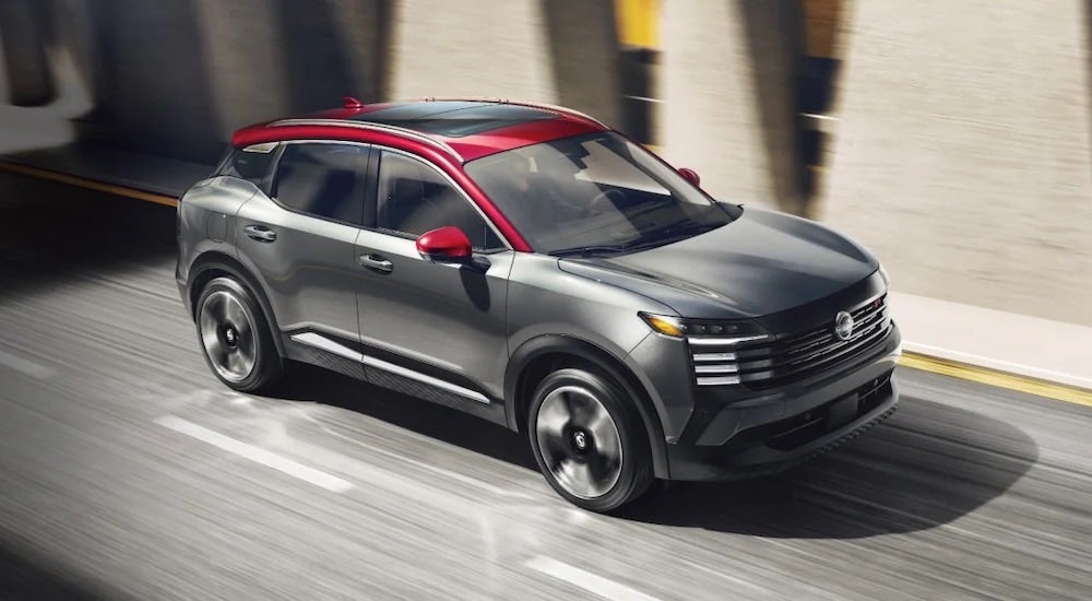 A grey 2025 Nissan Kicks for sale is shown from the front at an angle.