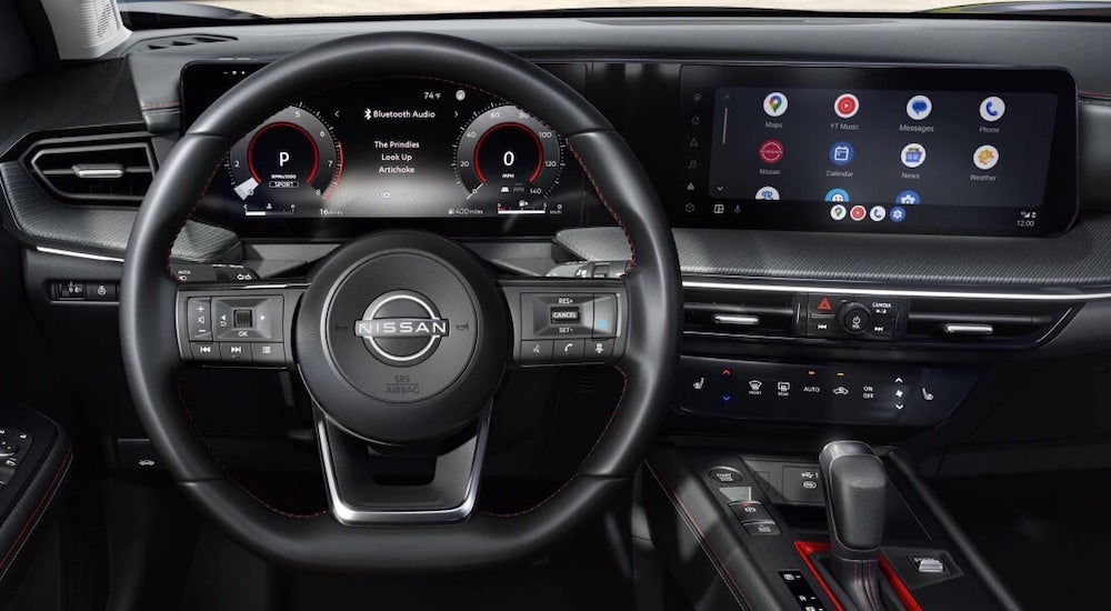 The black interior of a 2025 Nissan Kicks is shown.