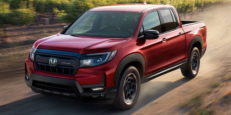 A red 2024 Honda Ridgeline.
