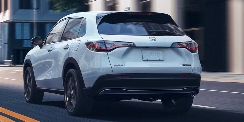 A 2024 Honda HR-V driving away from our point of view.