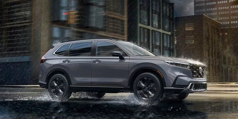 A 2024 Honda CR-V driving through rain.