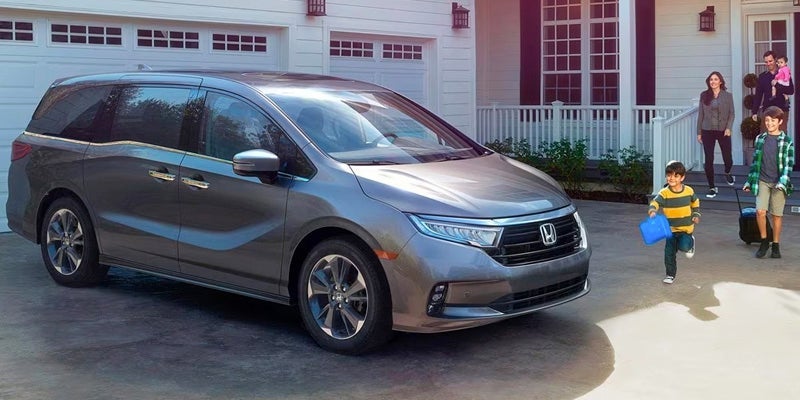 A family and their 2024 Honda Odyssey.