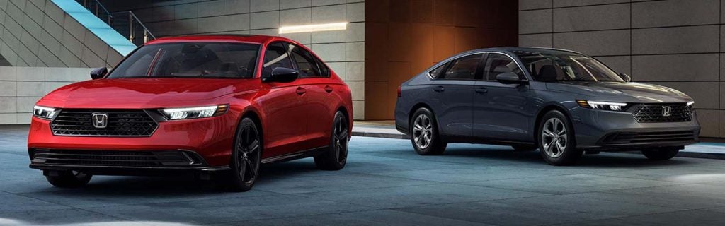 Honda vehicles displayed in a modern showroom setting featuring Certified Pre-Owned (CPO) models
Red and blue Honda sedans showcasing sleek designs, premium styling, and certified pre-owned inventory options