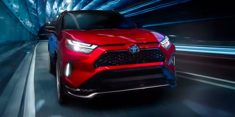 A red 2024 Toyota RAV4 Prime.