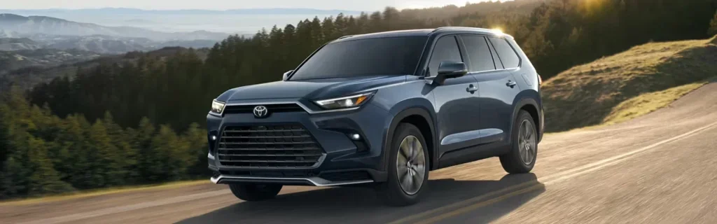 Toyota Grand Highlander SUV driving on a scenic mountain road during sunset
Toyota Grand Highlander showcasing spacious SUV design, refined styling, and adventurous capability