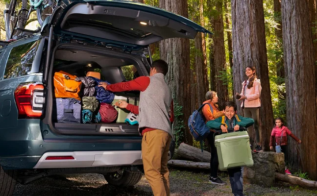 A family packing for a camping trip with their 2025 Ford Expedition near Anderson, Indiana