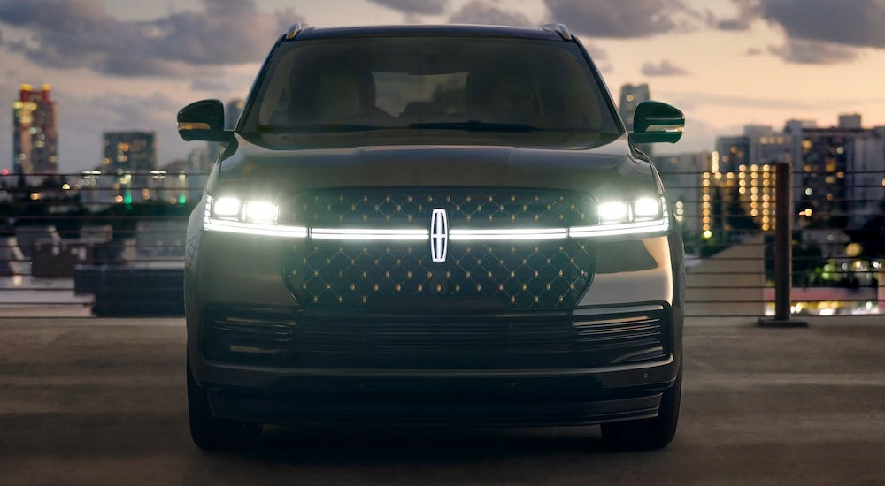 Front of a brown 2026 Lincoln Navigator parked on a pavement.