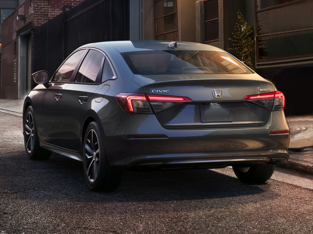 A gray Honda sedan parked outside