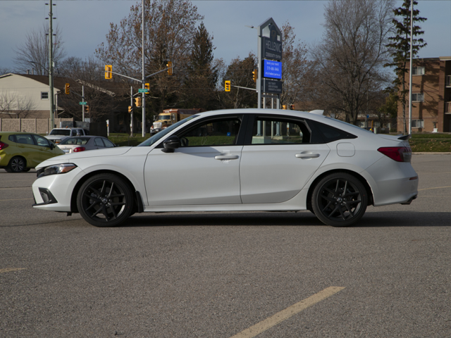 A white Honda Civic parked outdoors