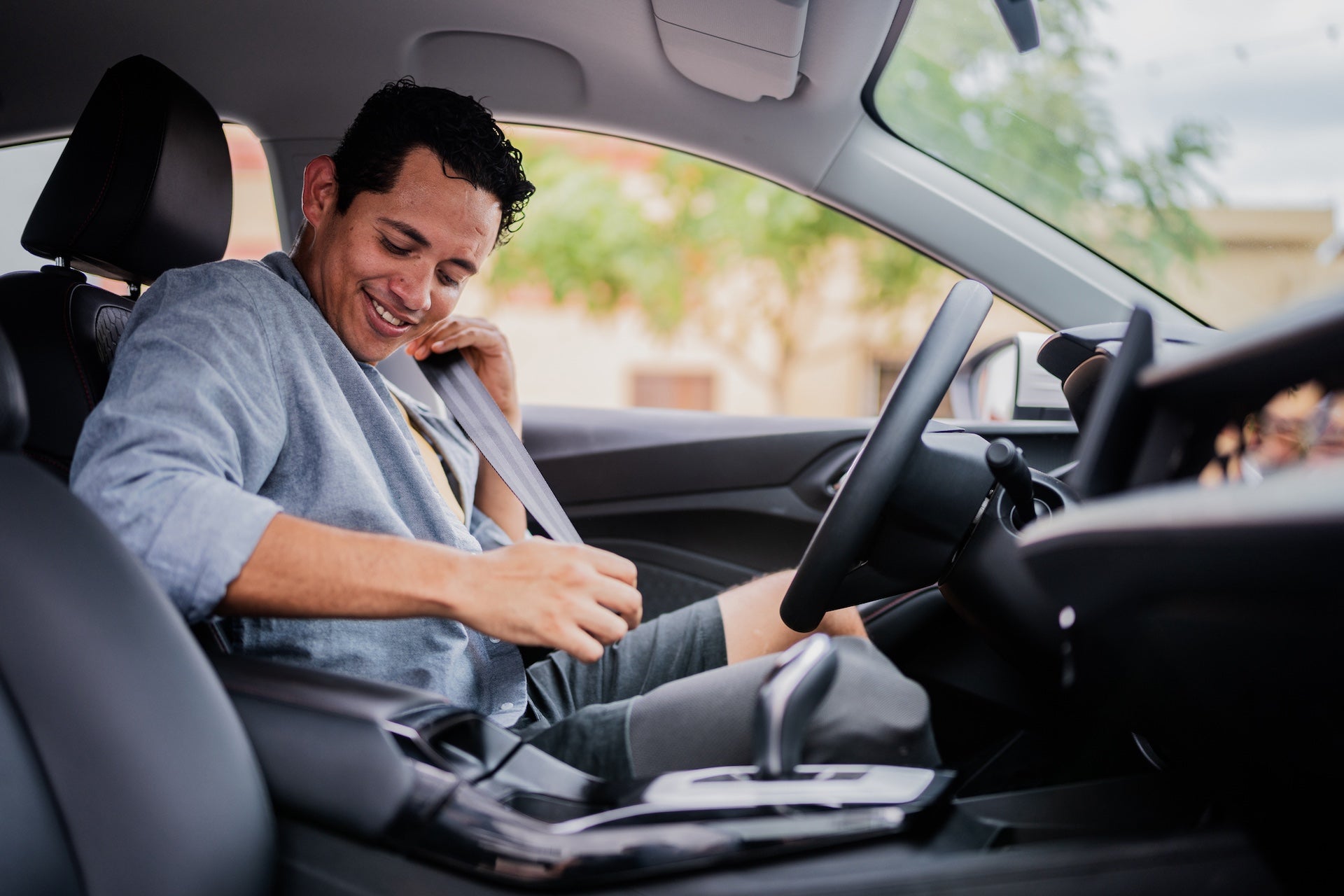 Mid adult man putting the seat in the car