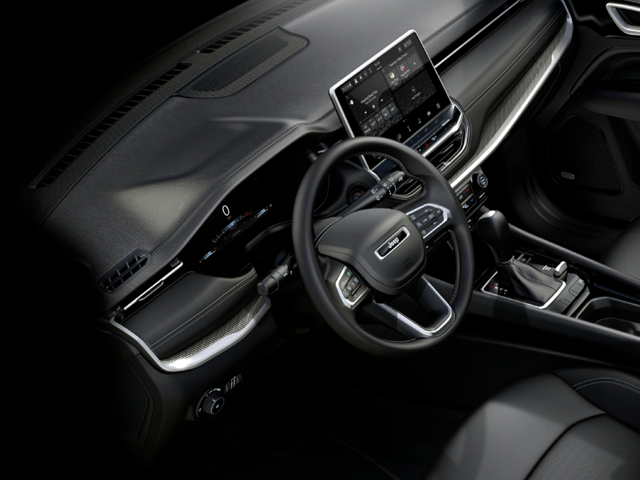 Steering wheel and dashboard view inside of a 2024 Jeep Compass | Auto service center in Hampton, VA | Banister CDJR Hampton