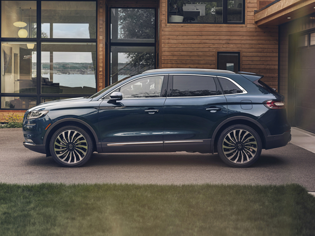 A Lincoln Nautilus parked outside of a house