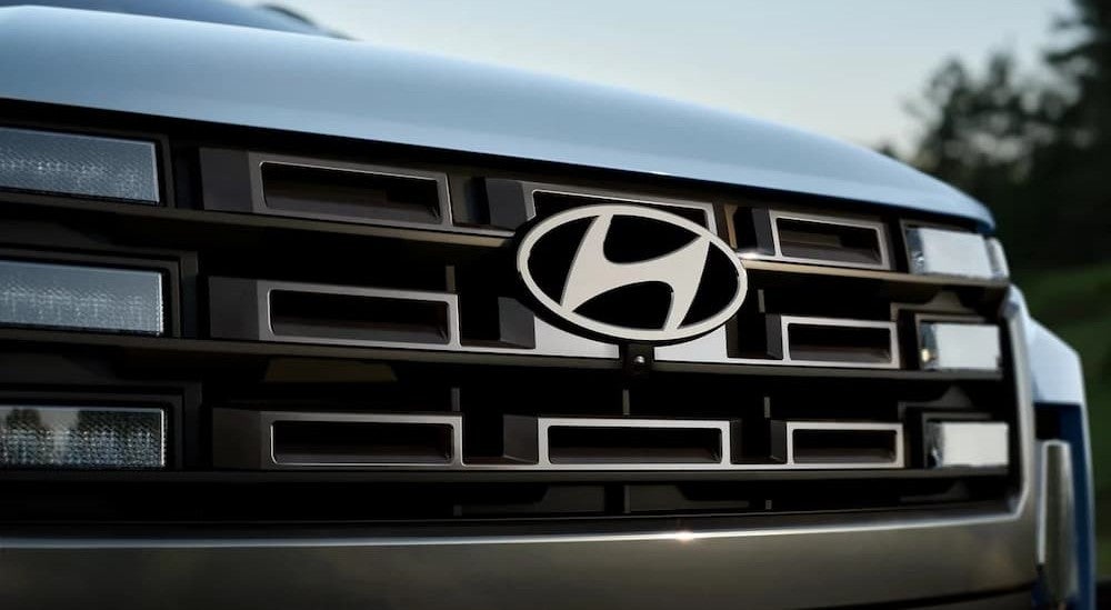The grille on a blue 2026 Hyundai Santa Cruz.