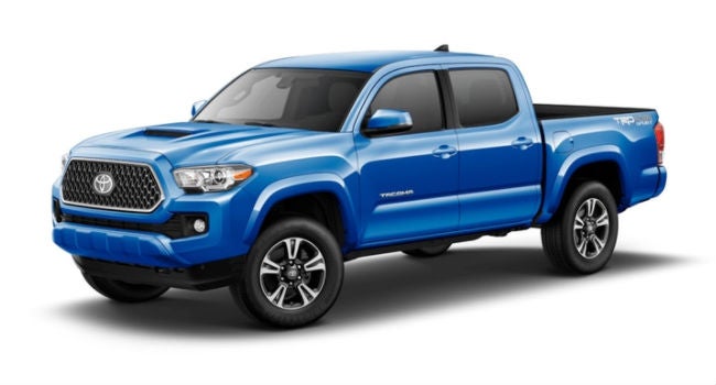 A front left quarter view of a Blazing Blue Pearl 2018 Tacoma