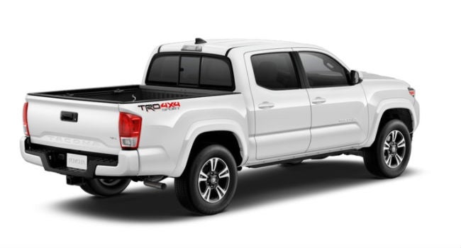 A right rear quarter view of a Super White 2018 Toyota Tacoma for sale at Heritage Toyota