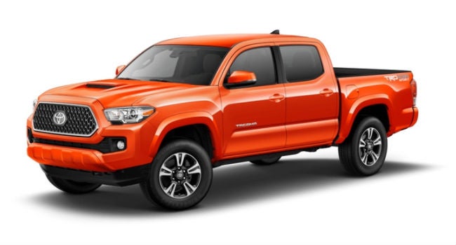 An Inferno colored 2018 Tacoma showing its right front corner