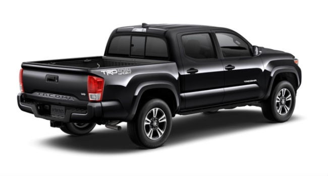 A Metallic Black 2018 Tacoma showing its right rear quarter