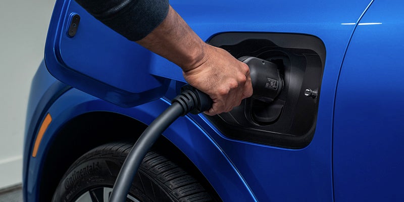 A 2025 Chevrolet Equinox EV being charged - Chevy Sustainability: How Chevrolet is Driving the Future of Eco-Friendly Vehicles